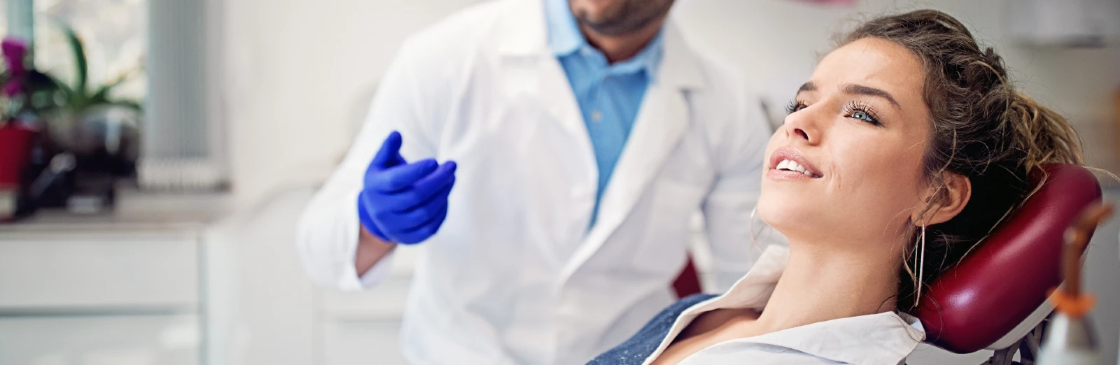 patient-laying-in-dental-chair-web1600x522.webp